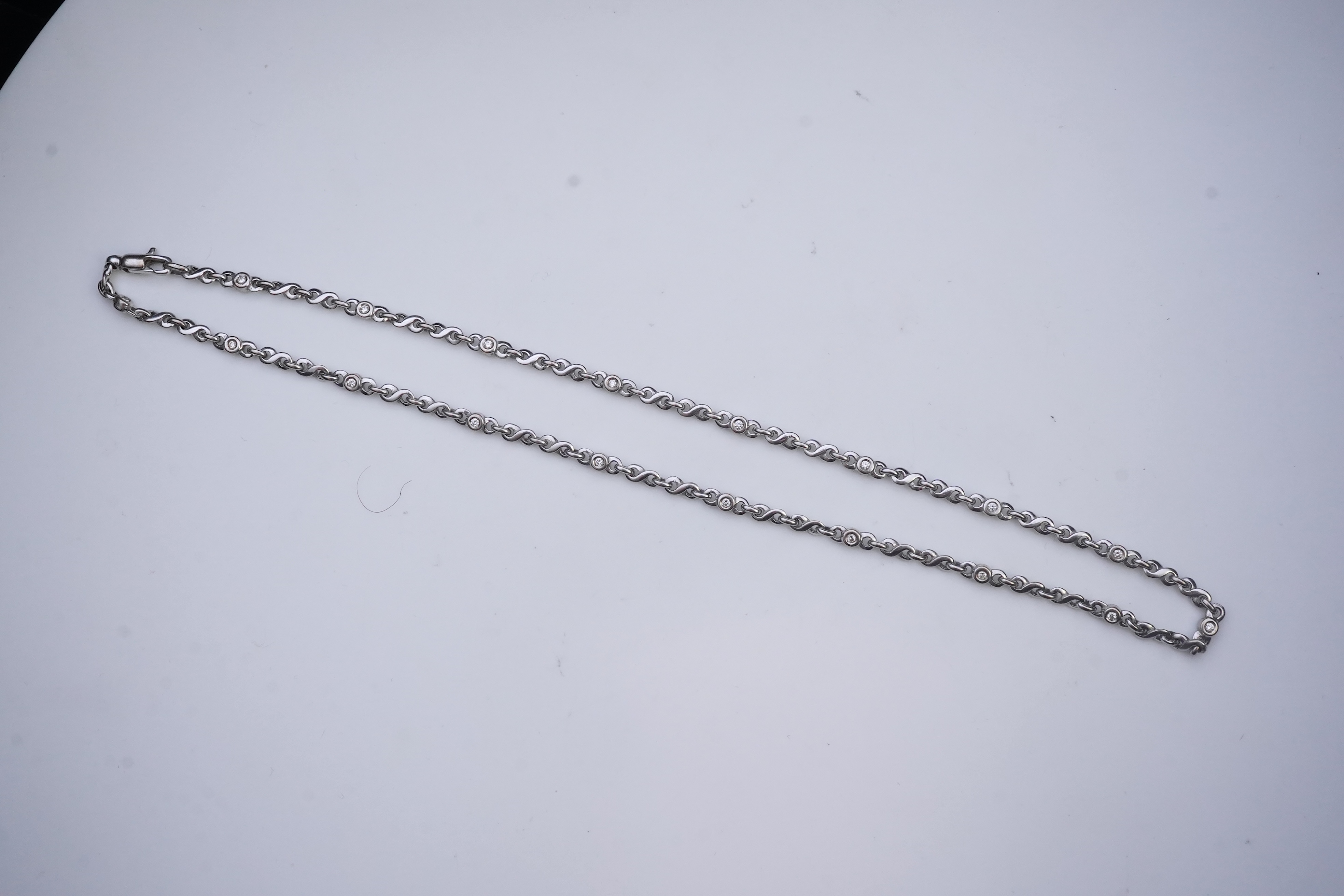 A white gold and diamond necklace